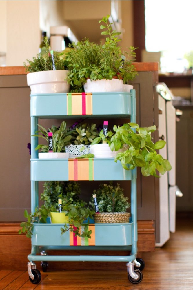 Another simple IKEA kitchen hack around is to turn your RASKOG trolley to place your plants and herbs