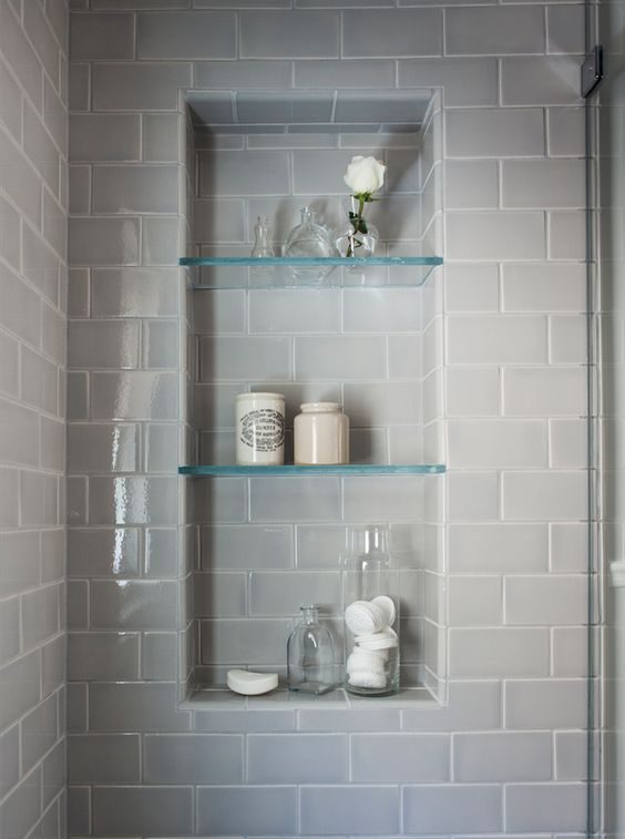 Glass shelves built into the shower area