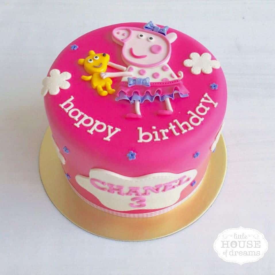 A tall round cake with Peppa Pig all dressed up for your child’s birthday party. Little House of Dreams.Source