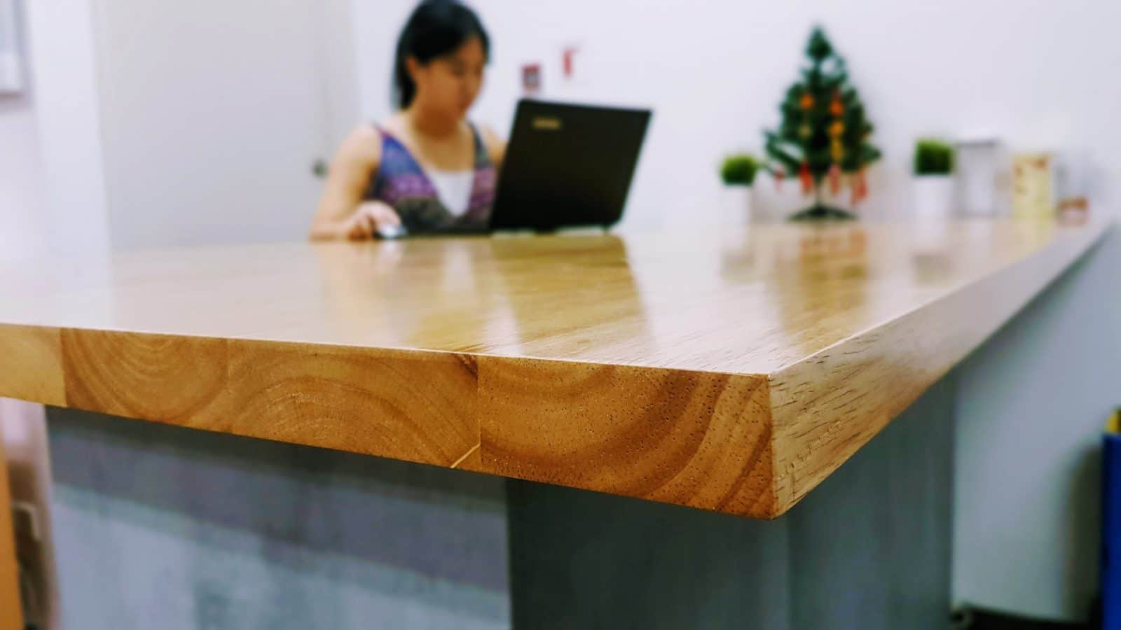 A kitchen island with a rubberwood counter. From the KONKRET design available at Recommend.my