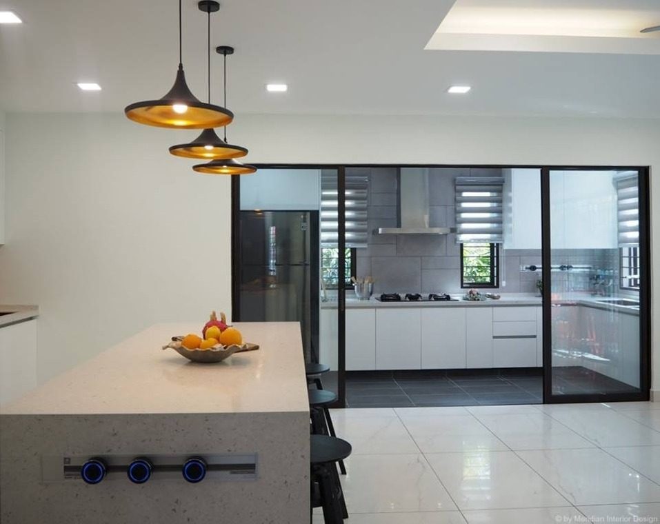 Above: Wet kitchen separated by glass sliding doors in Subang Jaya home. Design by Meridian Inspiration