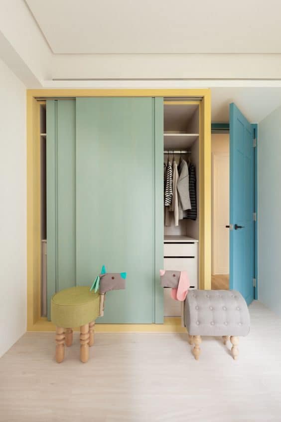 Pastel-themed kids wardrobe with sliding doors