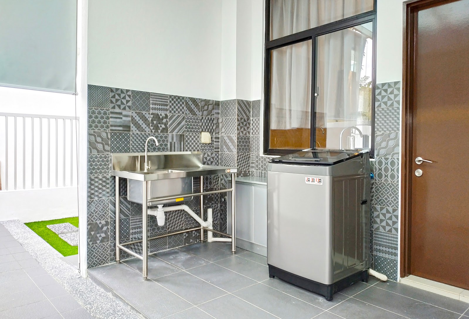 Above: The backyard of the home with wall tiles.