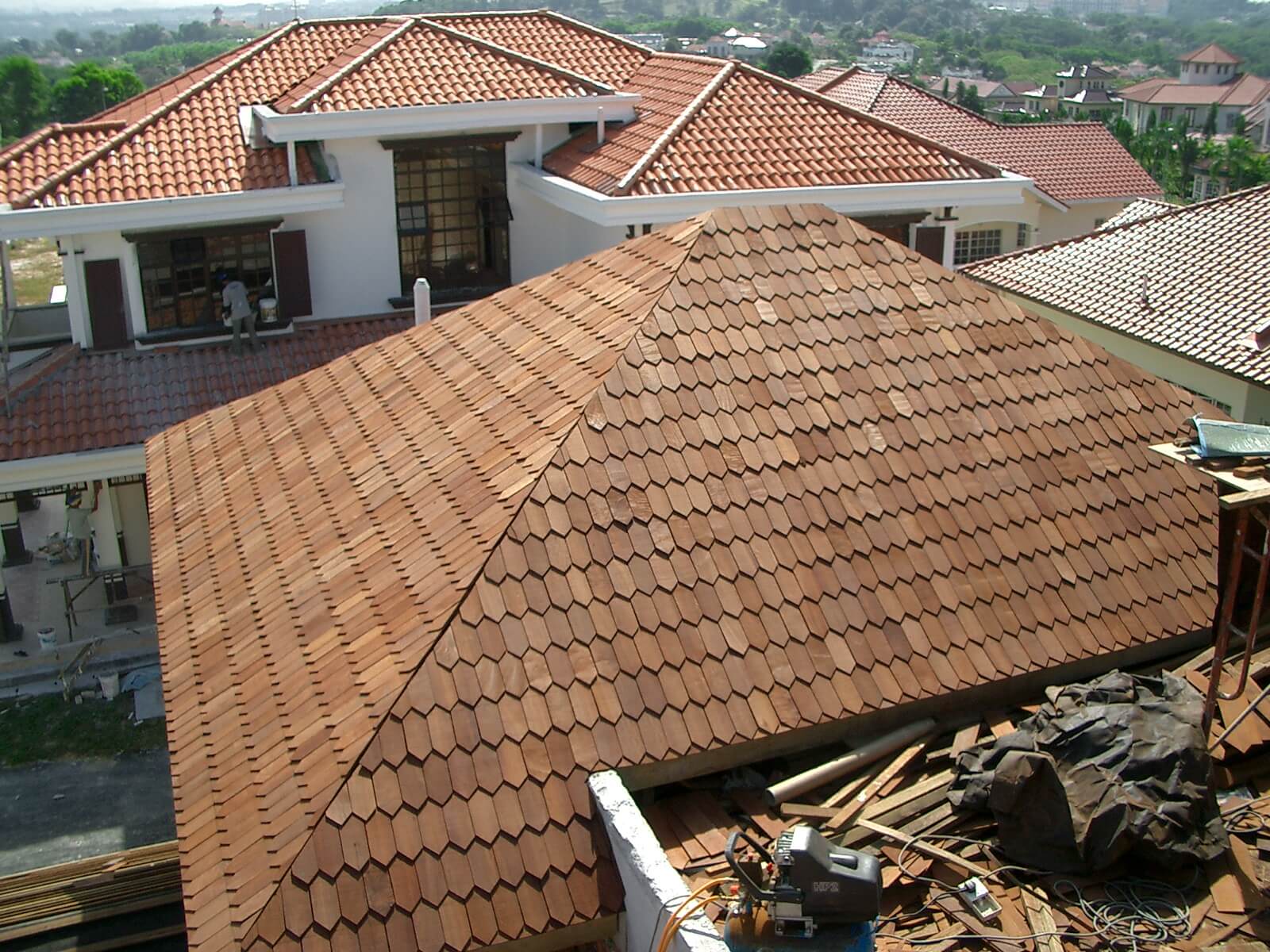 Hexagonal wood shingles give a unique look to this roof of a private bungalow. 