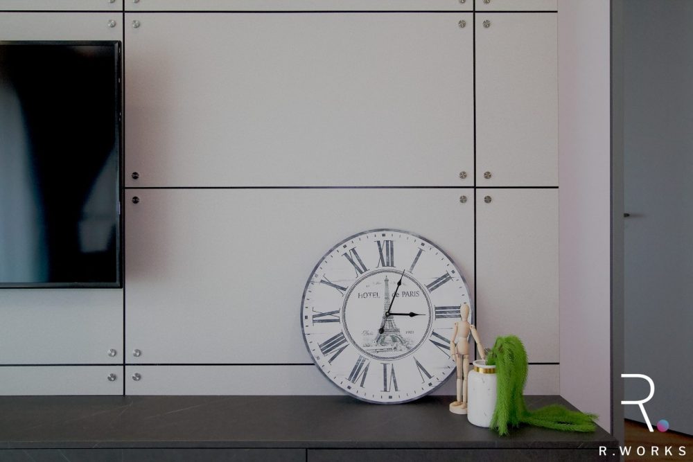 Close-up of TV console grey laminate feature wall