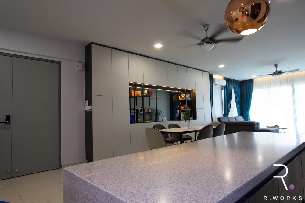Furnished dining area featuring grey laminate cabinet with a wide display niche