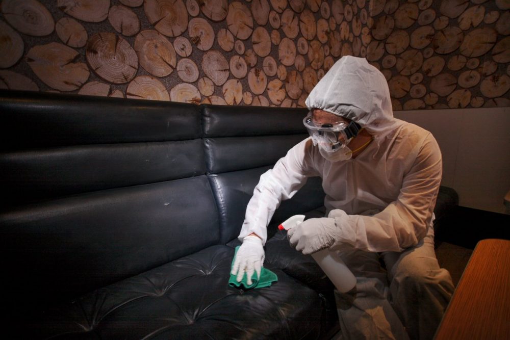 Wiping surfaces with disinfectant. Photo: Red Box