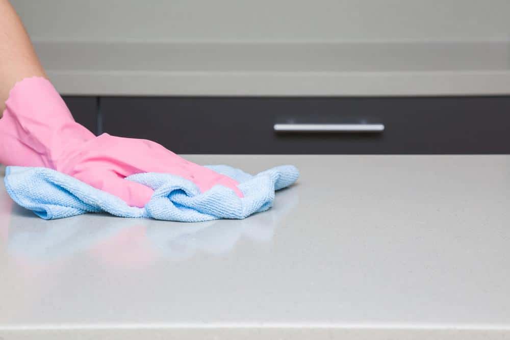 Wiping down hard surfaces with disinfectant solution