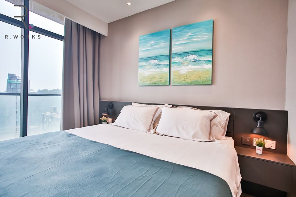 Ocean blue accents in the second bedroom of the Empire City unit, Damansara 