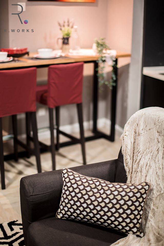 Dark brown furnishing in the living room with geometrical pattern accents at Empire City, Damansara