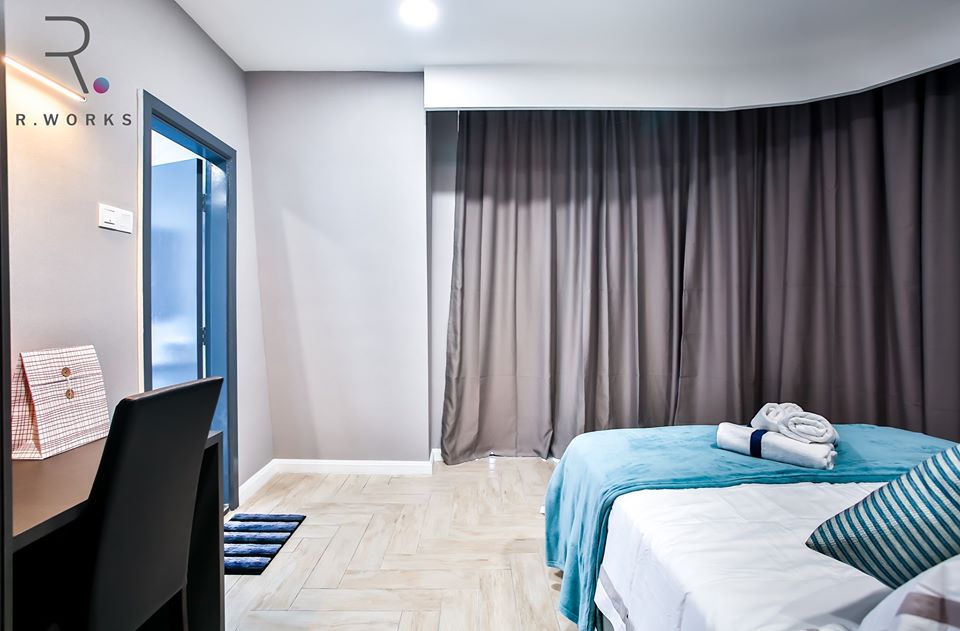 View of the draped curved window in master bedroom