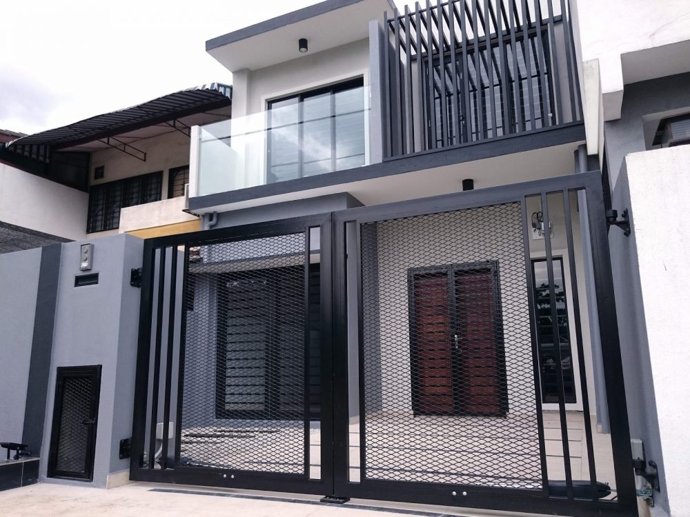Completed black and white accented exterior design for two-storey terrace house in Cheras. By Dyreka Group