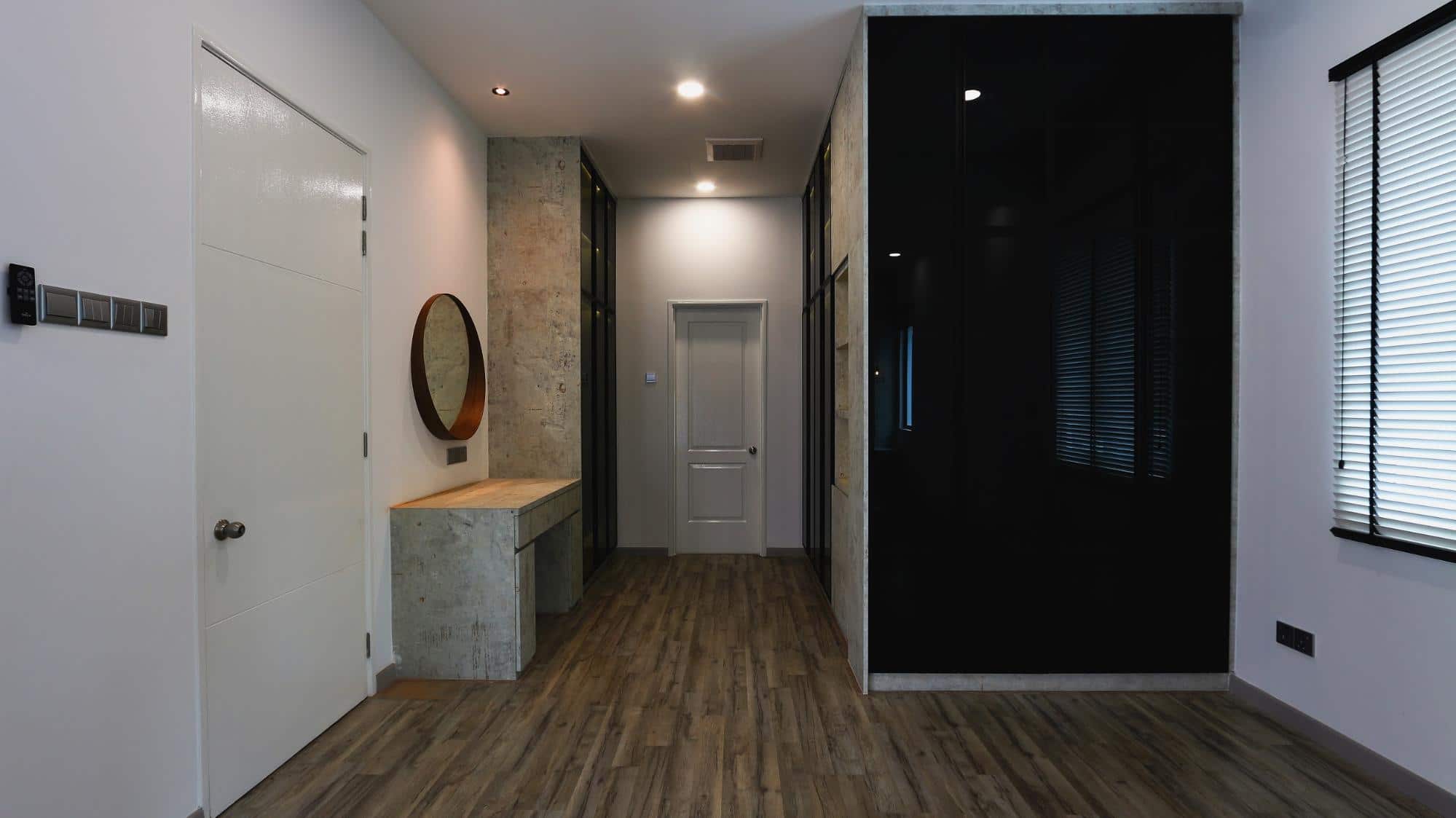 Modern industrial bedroom design with grey industrial textured laminates and grey mirrors