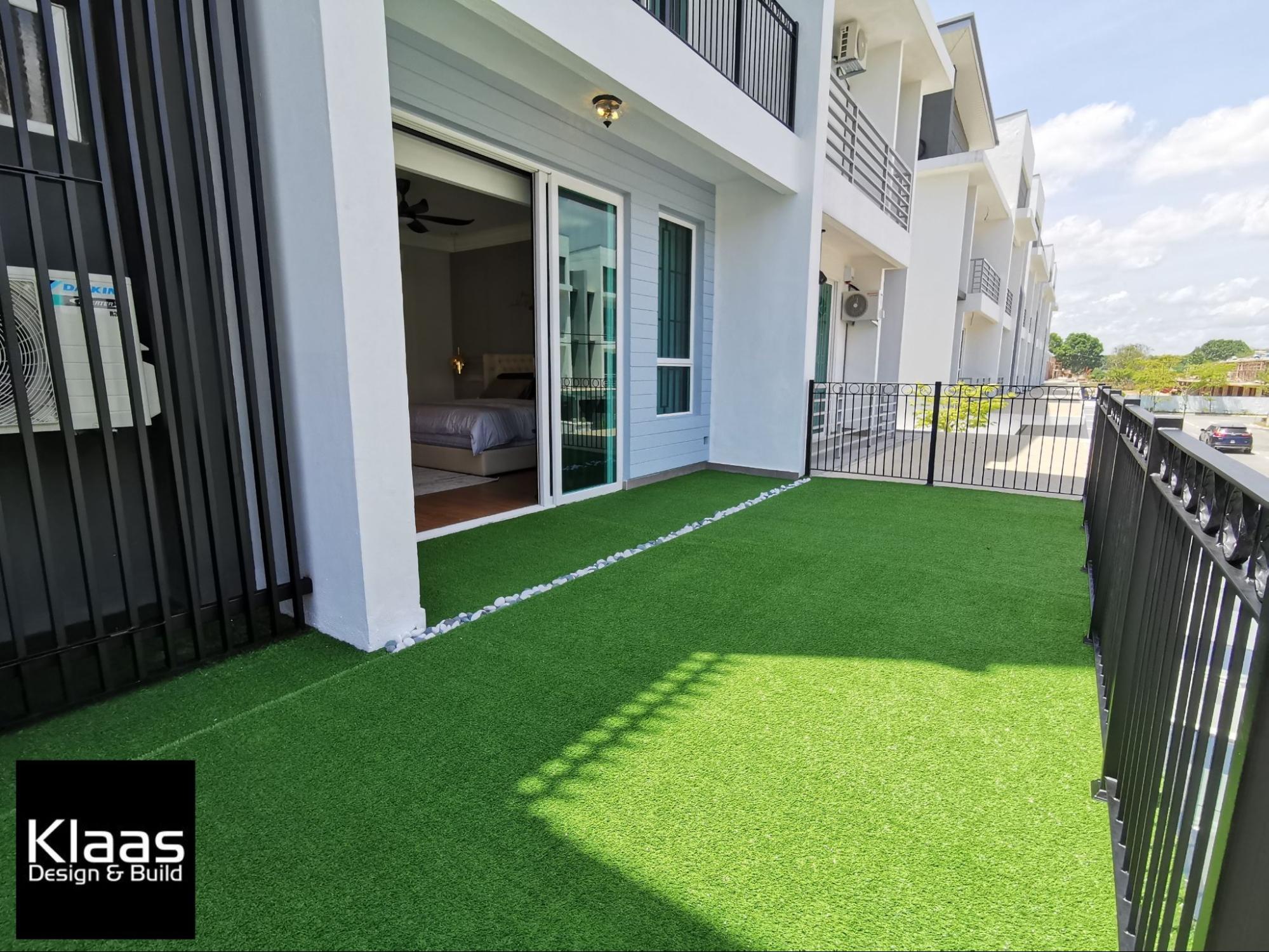 Balcony garden with fake grass patches 