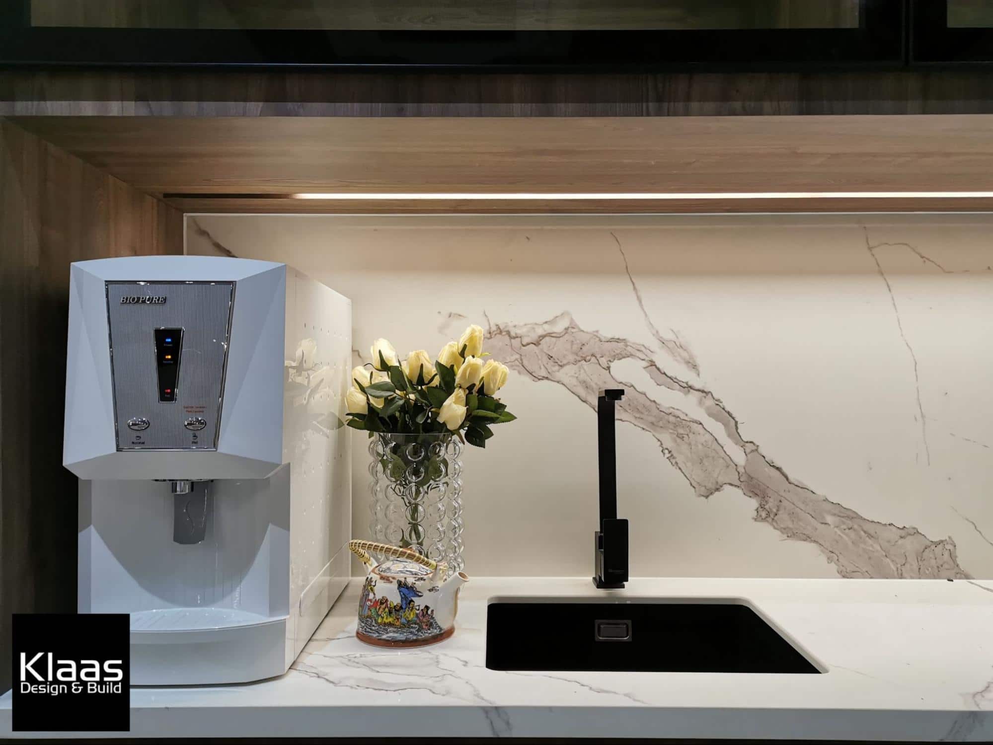 Close-up of marble kitchen counter and backsplash