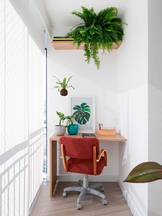 Enclosed balcony makeover with greenery