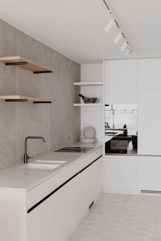 White minimalist kitchen with bare minimum fixtures 