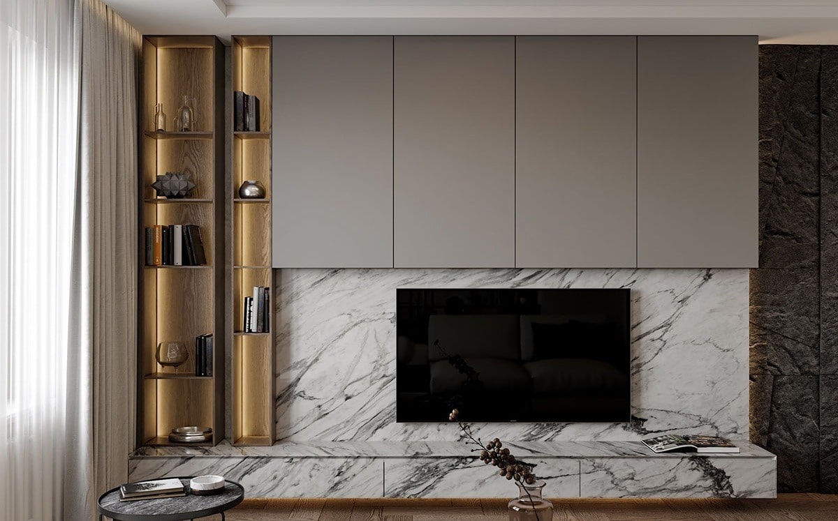 Built-in TV console with marble panels and gold accents 