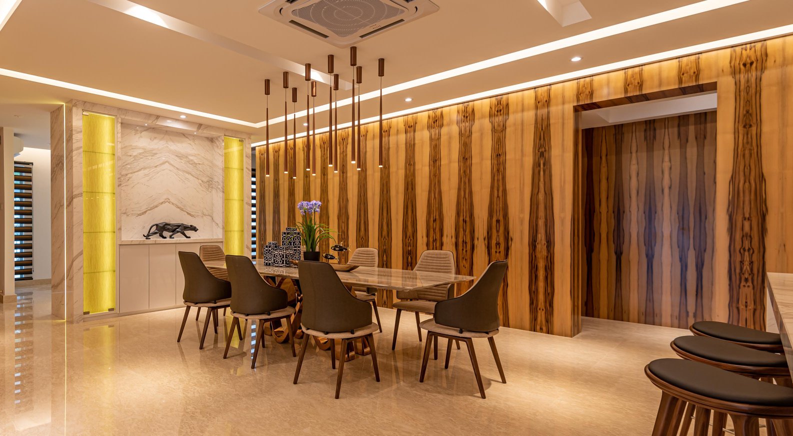 Dining room with wood patterned feature wall