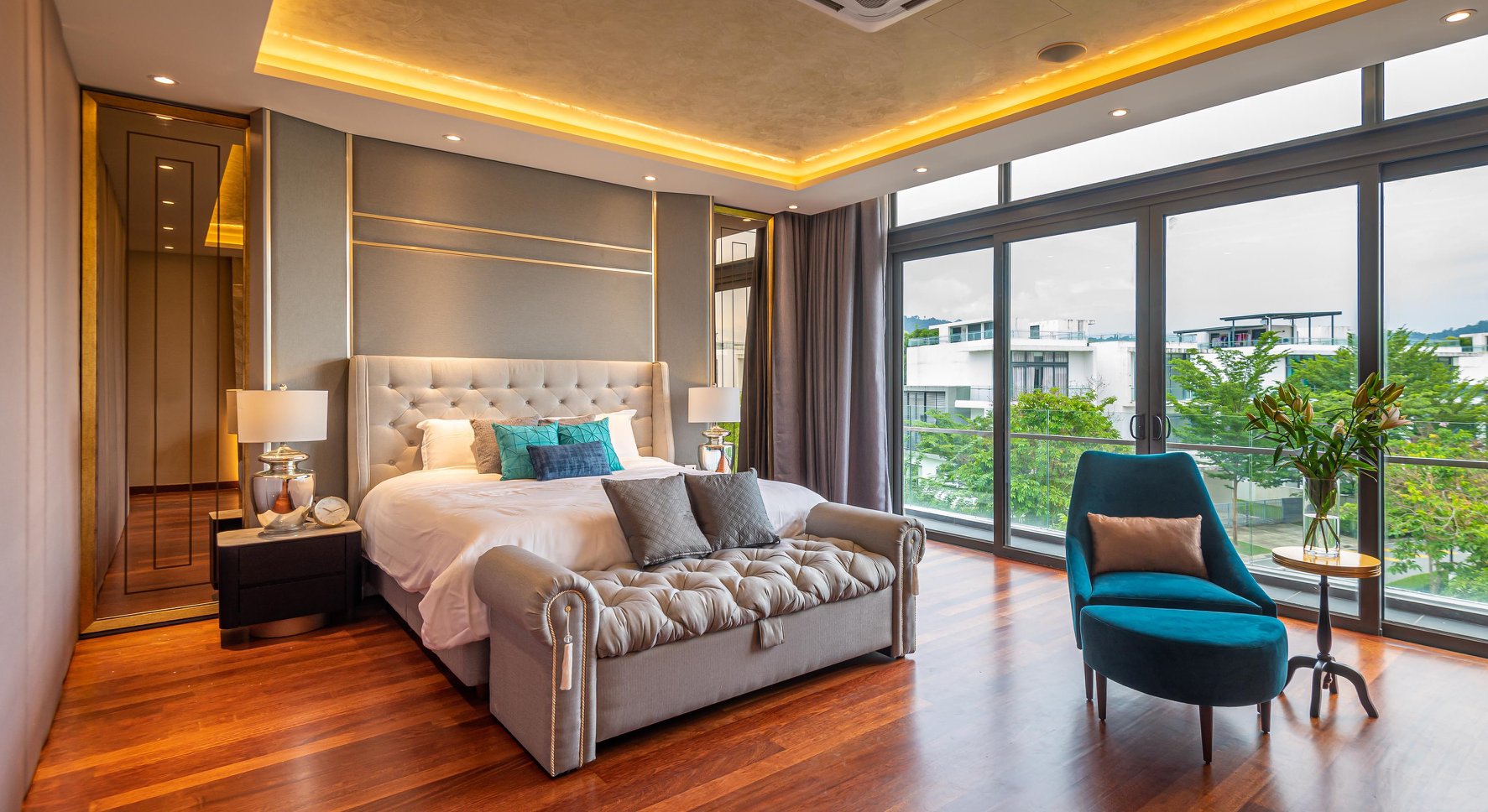 Grey toned master bedroom with full length windows