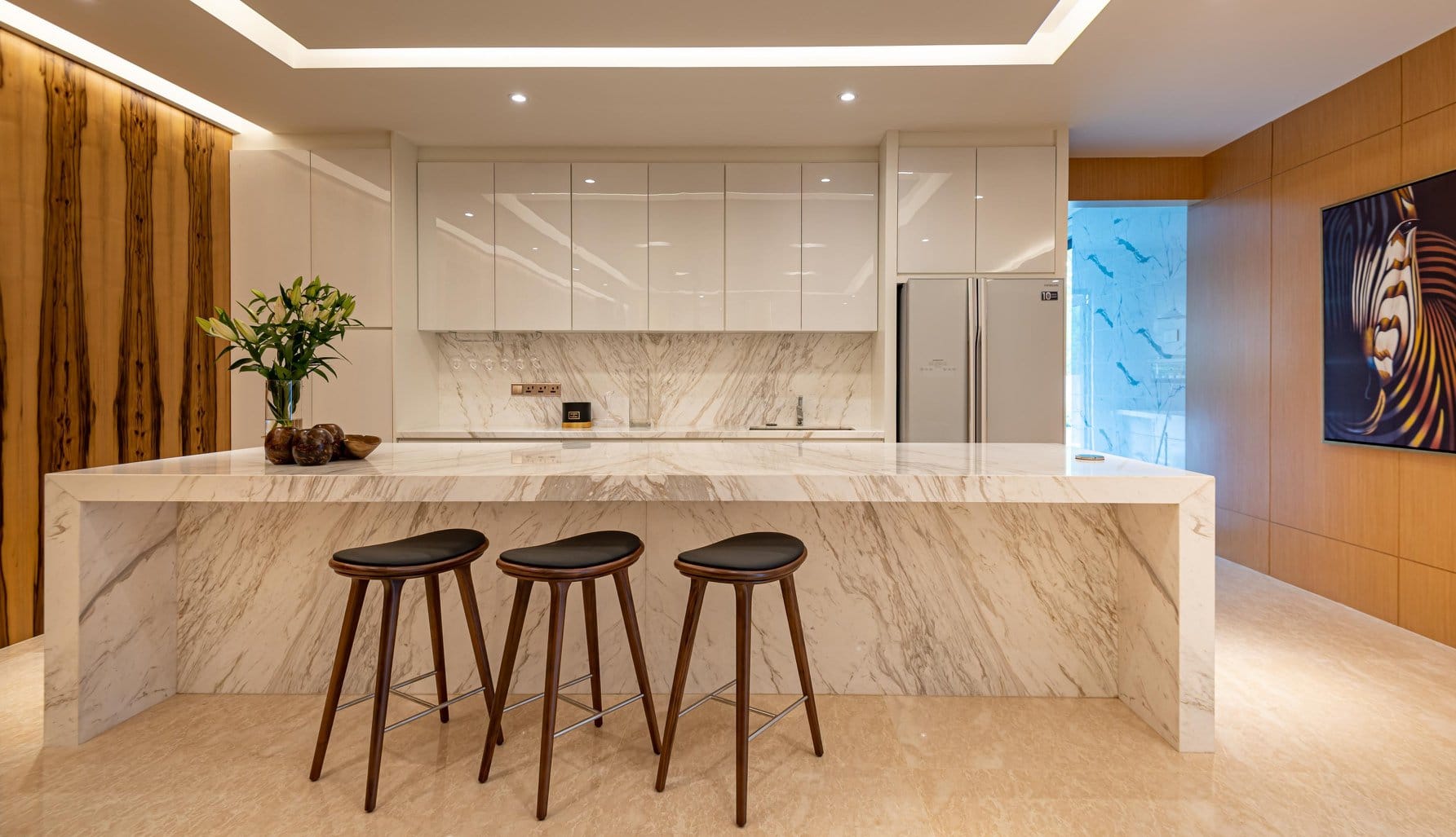 White dry kitchen cabinet with marble backsplash and kitchen island