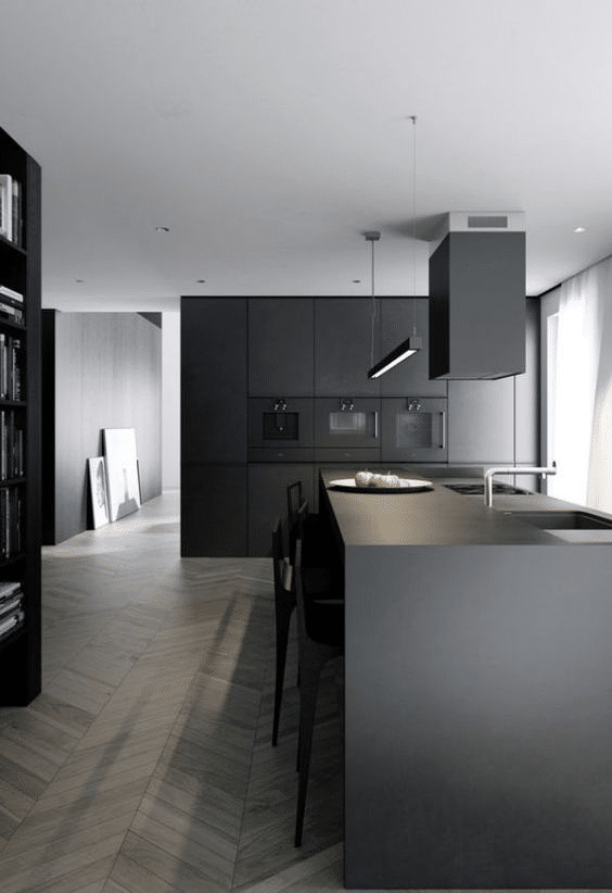 Fully matte black kitchen with a kitchen island and cooker hood
