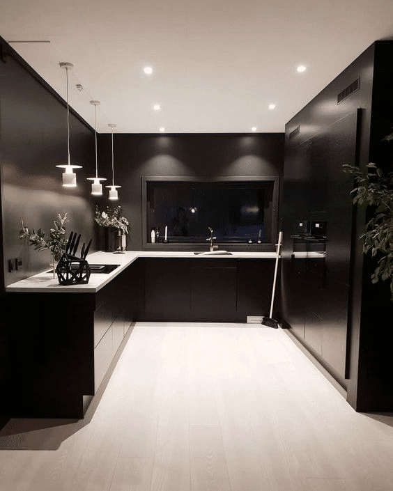 Modern minimalist black kitchen design with hanging lamps