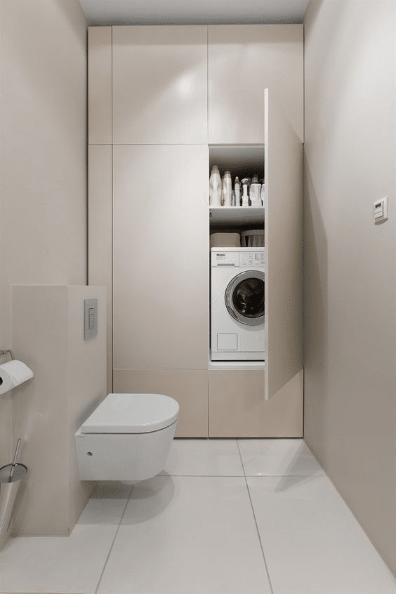 Hidden laundry nook in bathroom cabinet 