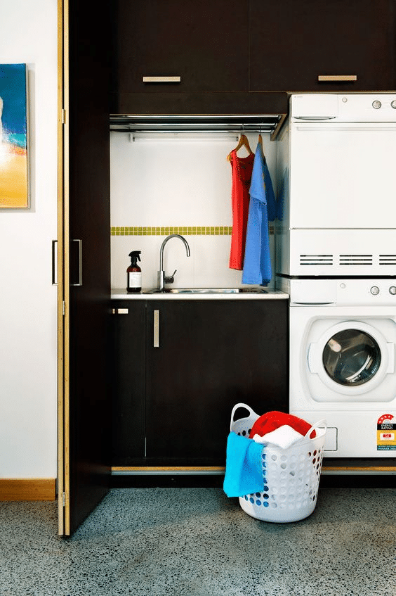 Full black modern hidden laundry nook