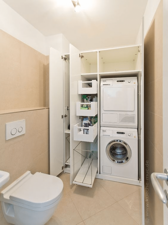 Hidden laundry area in bathroom with pull-out racks